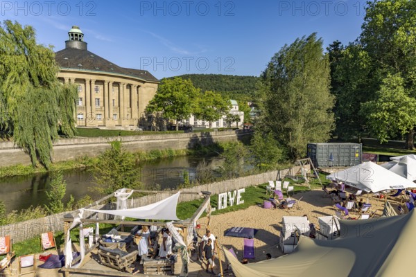 Kiss Beach beer garden and beach bar on the Franconian Saale and Regentenbau in the Bad Kissingen state spa, Lower Franconia, Bavaria, Germany