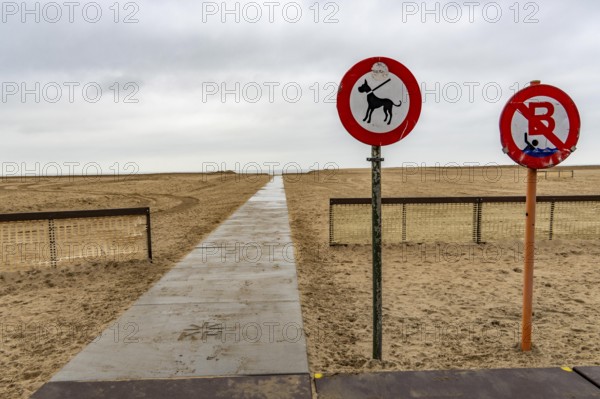 Winter break, on Zeedijk-Knokke, beach promenade in Knokke-Heist, on the North Sea beach, dreary winter day, prohibition signs, on the North Sea, Belgium