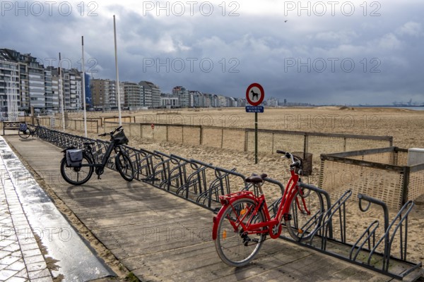 Winter break, on Zeedijk-Knokke, beach promenade in Knokke-Heist, on the North Sea beach, dreary winter day, mostly apartment buildings with rental or condominiums, high-rise buildings on the street, Belgium