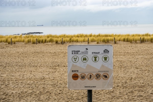 Winter break, on the Zeedijk-Knokke, beach promenade in Knokke-Heist, commandment sign, prohibition sign, for the dress code on the North Sea beach and in the city, dreary winter day, Belgium