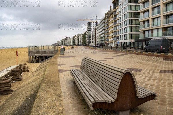 Zeedijk-Knokke, beach promenade in Knokke-Heist, on the North Sea beach, dreary winter day, mostly apartment buildings with rental or condominiums, high-rise buildings on the street, Belgium
