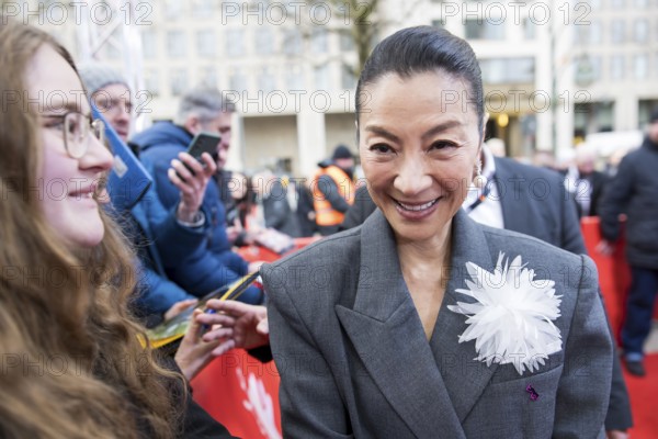 Michelle Yeoh has herself photographed with fans in front of the premiere of the film Everything Everywhere All At Once at the Berlinale in Berlin's Zoo Palast on 13.02.2026. The 76th Berlin International Film Festival will take place from February 12 to 22, 2026