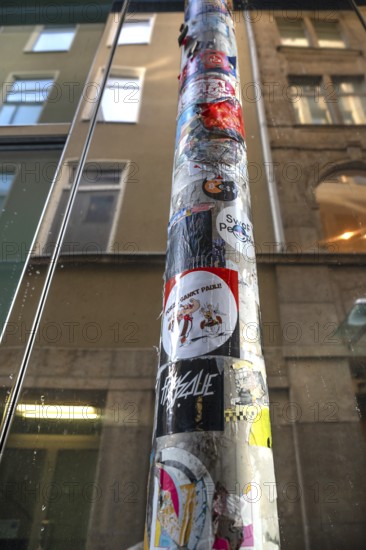 Rain pipe covered with stickers, Nuremberg, Middle Franconia, Bavaria, Germany