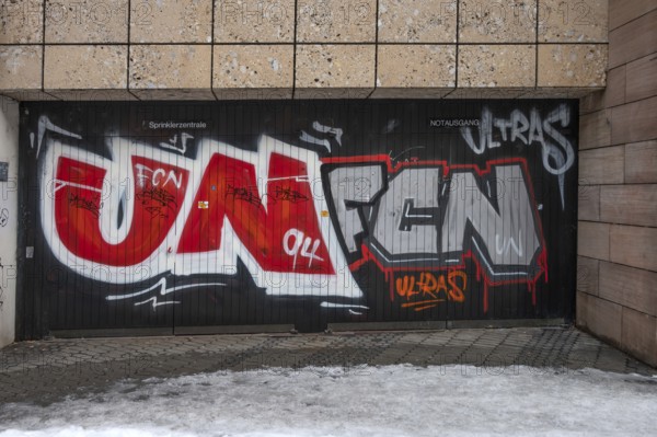 Illegal graffiti of the Nuremberger 1st FCN of the Ultras at an emergency exit, Nuremberg, Middle Franconia, Bavaria, Germany