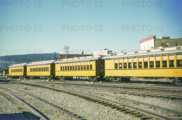 Passenger railway carriages of the Denver and Rio Grande Western Narrow Gauge Railroad, at depot and rail yard, Durango, Colorado, USA 1977