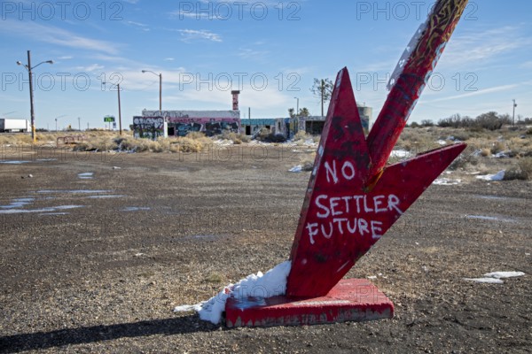 Twin Arrows, Arizona - The ruins of the Twin Arrows Trading Post, which closed in 1995. The building are now covered with graffiti, and one of the two arrows has fallen