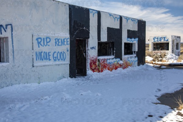 Twin Arrows, Arizona - The ruins of the Twin Arrows Trading Post, which closed in 1995. The building are now covered with graffiti, including a remembrance of Renee Good, who was killed by an ICE agent in Minneapolis in January 2026