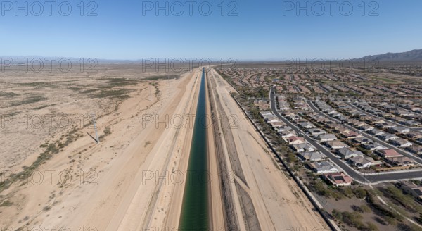 Buckeye, Arizona - The Central Arizona Project canal brings Colorado River water past Sun City Festival, a Dell Webb retirement community in the desert of Arizona. The water shortage in the western U.S. is limiting the expansion of similar housing projects