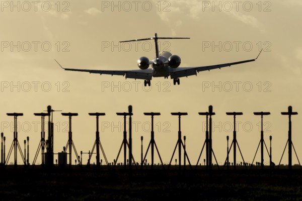 Gulfstream executive business jet aircraft in flight on approach to land at sunset at London Stansted airport, Essex, England, United Kingdom