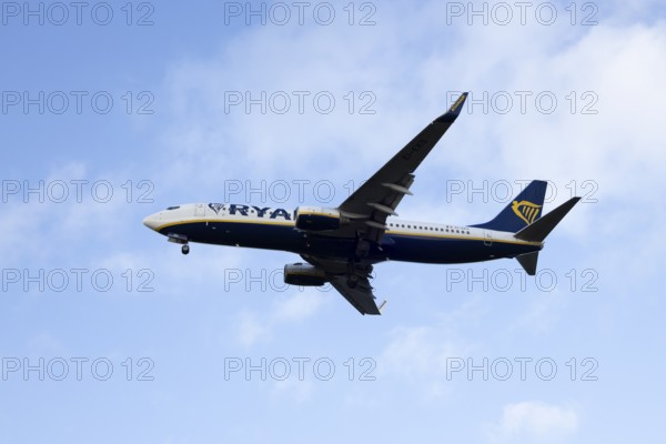 Boeing 737 commercial passenger airliner jet aircraft of Ryanair airways in flight on approach to land at London Stansted airport, Essex, England, United Kingdom