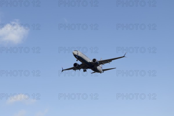 Boeing 737 commercial passenger airliner jet aircraft of SunExpress airways in flight on approach to land at London Stansted airport, Essex, England, United Kingdom