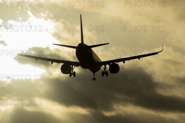 Airbus A321 commercial passenger airliner jet aircraft of Pegasus airlines flying on approach to land at sunset at London Stansted airport, Essex, England, United Kingdom