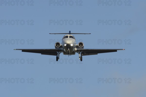 Cessna Citation small executive business jet aircraft in flight on approach to land at London Stansted airport, Essex, England, United Kingdom