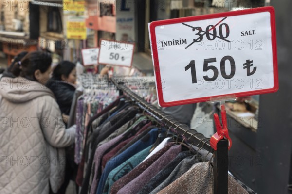 Istanbul, Turkey 7th January 2025. Local shoppers browsing clothes reduced in price in a popular textile bazaar in the Fatih district of Istanbul, Turkey