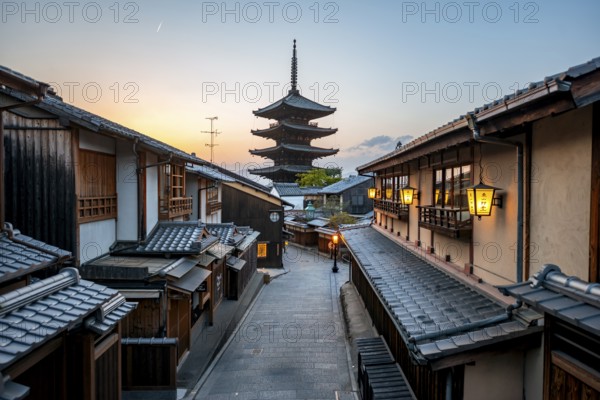 Yasaka dori historic street in the old town with traditional Japanese houses, five-story Yasaka Pagoda of the Buddhist Hokanji Temple at the back, evening mood, Higashiyama, Kyoto, Japan