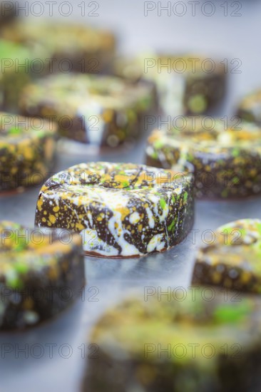 Close-up of a chocolate with a lively, colorful design, vegan chocolates production, Haselstaller Hof, Gechingen, Germany