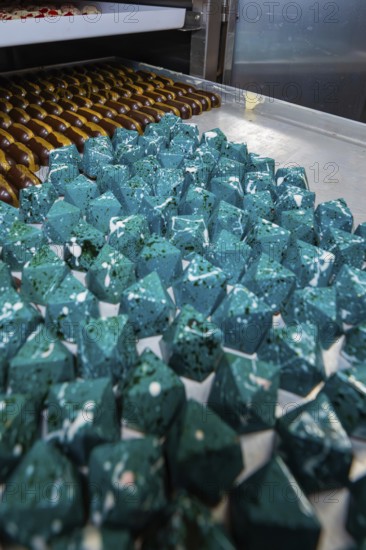 Blue prismatic chocolates with shiny surface in a bakery, Easter production of regional products, Haselstaller Hof, Gechingen, Calw district, Germany