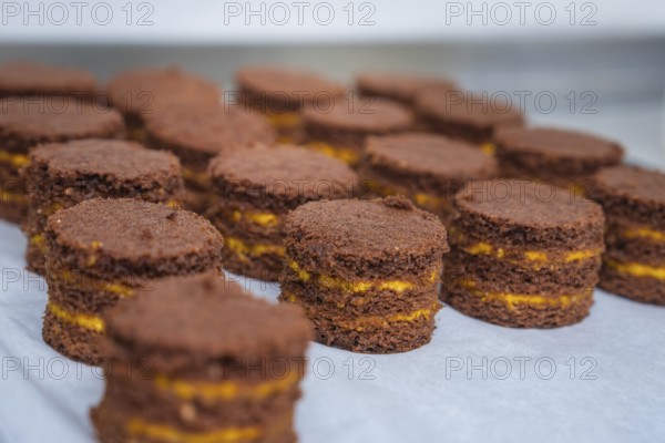 Chocolate chip cookies with filling on a tray, vegan cake production, Haselstaller Hof, Gechingen, Germany