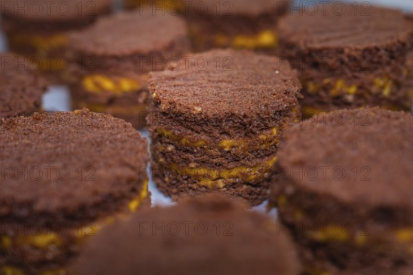 Close-up of small chocolate cakes with yellow layers, vegan cake production, Haselstaller Hof, Gechingen, Germany
