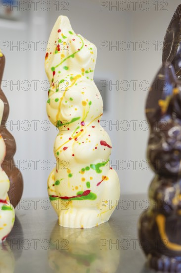 White chocolate figure with colorful food decorations, Easter production of regional products, Haselstaller Hof, Gechingen, Calw district, Germany