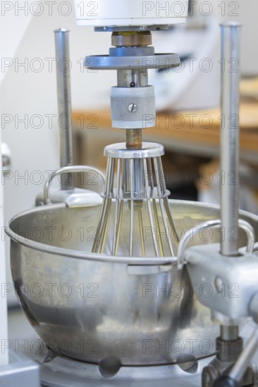 Large mixing machine with metal bowl in a professional kitchen, chocolate quail eggs, Easter production, Haselstaller Hof, Gechingen, Germany