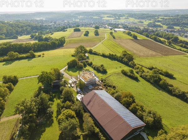 Panoramic view of rural landscape with fields, buildings and a small village, timber house construction, Gechingen, Germany