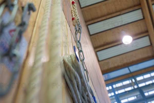 Rope suspension in a sports hall with wooden paneling and lamp light, Schlehengäu Sporthalle Gechingen, Calw district, Germany