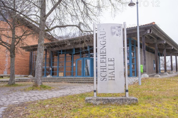 Schlehengäu Halle building with sign in front of it, surrounded by trees, winter atmosphere, Schlehengäu sports hall Gechingen, Calw district, Germany