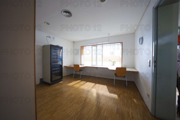 Simple break room with vending machine, chairs and large window, Schlehengäu sports hall Gechingen, Calw district, Germany