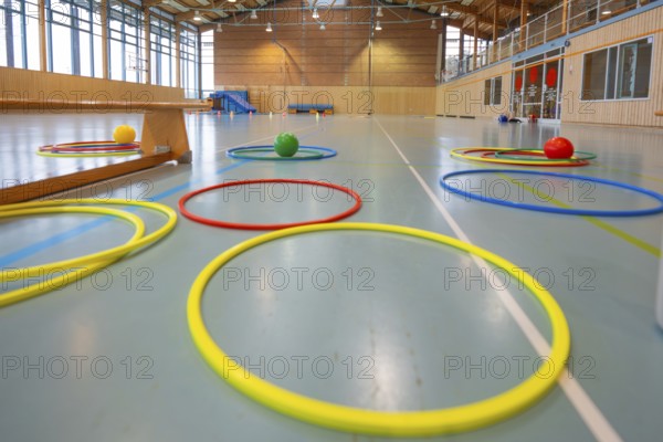 Various tires and balls on the floor of a light-flooded gym, Schlehengäu Sporthalle Gechingen, Calw district, Germany