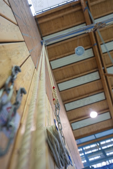 Climbing rope attached to a sports hall with wooden walls and neon lights, Schlehengäu Sporthalle Gechingen, Calw district, Germany