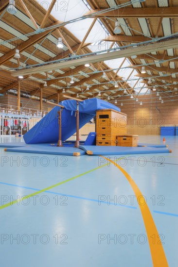 Gymnastic equipment and mats in the wooden sports hall, bright and spacious atmosphere, Schlehengäu sports hall Gechingen, Calw district, Germany