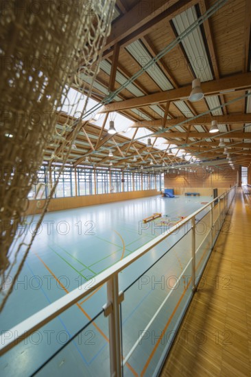 Interior view of a sports hall with marked fields and a dominating wooden structure, Schlehengäu sports hall Gechingen, Calw district, Germany