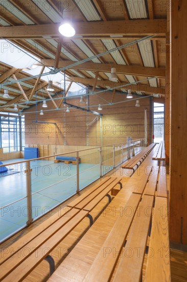 Interior of a gym with long benches and natural light, Schlehengäu Sporthalle Gechingen, Calw district, Germany