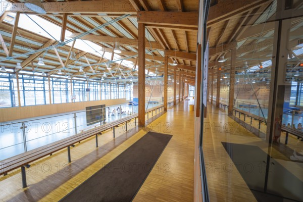 Long corridor in a gymnasium with large glass front and wooden architecture, Schlehengäu Sporthalle Gechingen, Calw district, Germany