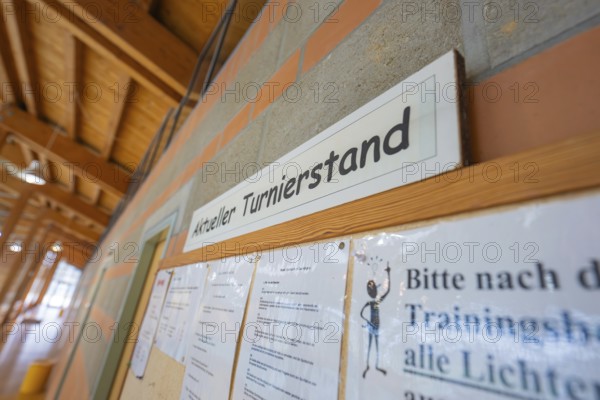 Information board with current tournament status on a brick wall, Schlehengäu Sporthalle Gechingen, Calw district, Germany