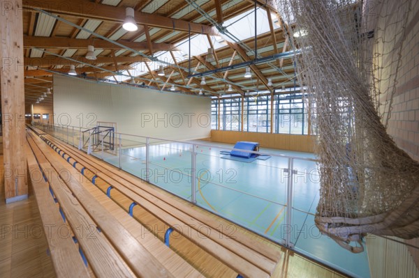 View over the stand of a sports hall with wooden structure and playing field, Schlehengäu Sporthalle Gechingen, Calw district, Germany