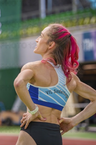 Sportswoman from behind in the stadium, sports outfit, pink hair tied in a braid, middle distance runner Katharina Jaiser, Sindelfingen Glass Palace, Germany