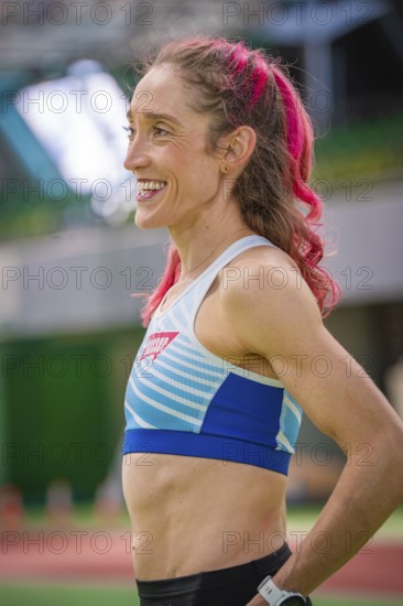 Smiling sportswoman with pink hair in stadium, looks fit and friendly, middle distance runner Katharina Jaiser, Gechingen, Germany