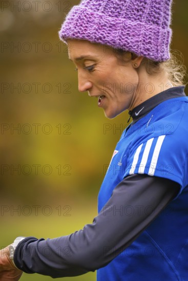 Close-up of a woman wearing sporty clothes, in an autumn setting, middle distance runner Katharina Jaiser, Gechingen, Germany