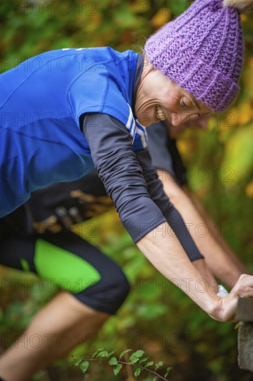 Close-up of a woman doing outdoor training in autumn, wearing sportswear and smiling, middle distance runner Katharina Jaiser, Gechingen, Germany
