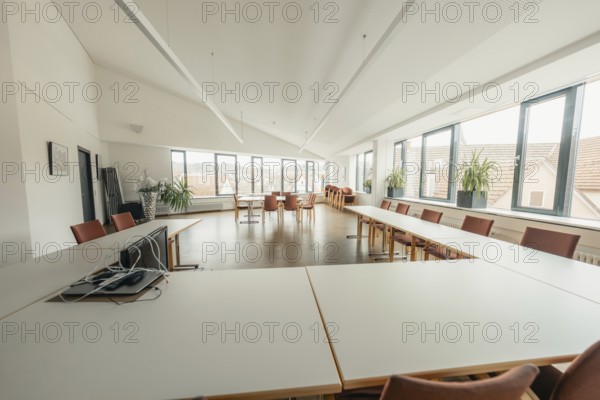 Bright meeting room with large windows and simple furniture, Gechingen Town Hall, Calw District, Germany