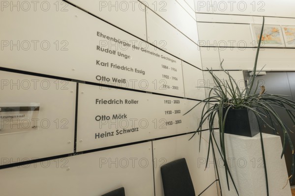 Wall with honorary citizenship, simply designed, surrounded by plants, Gechingen Town Hall, Calw district, Germany