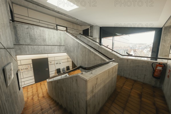 Functional staircase with concrete walls and skylight, minimalist aesthetics, Gechingen Town Hall, Calw district, Germany