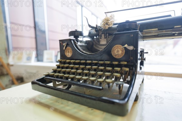 Antique typewriter in front of a window, nostalgic atmosphere, Gechingen Town Hall, Calw district, Germany
