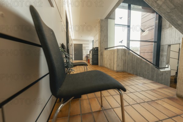 Modern, minimalistic interior with chairs and wooden tiles, Gechingen Town Hall, Calw District, Germany