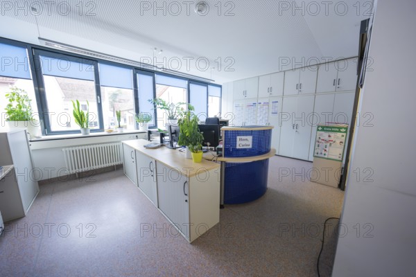 Office with large work area, desks and plants in front of large windows, Gechingen Town Hall, Calw district, Germany