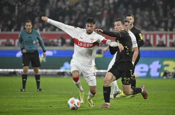 Atakan Karazor VfB Stuttgart (16) v Kristoffer Lund 1. FC Köln KOE (32) Referee Referee Robert Hartmann Soccer Bundesliga, MHPArena, MHP Arena Stuttgart, Baden-Württemberg, Germany
