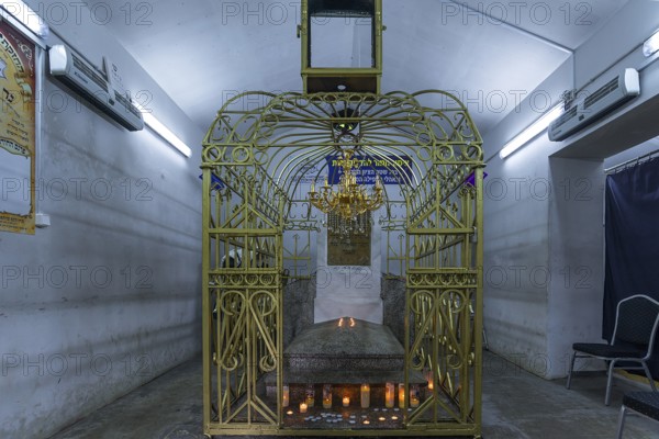 Tomb of Hasidic Rabbi Elimelech in a gilded grid at the Lezajsk Jewish Cemetery, Poland