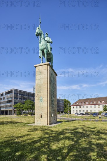 Equestrian statue Lanzenreiter, sculptor Paul Wynand, pedestal, architect Adolf Abel, general development, modern architecture, lawn, trees, blue sky, cirrus clouds, Urbanstraße, Kennedy-Ufer, Cologne, district-free city, North Rhine-Westphalia, Germany